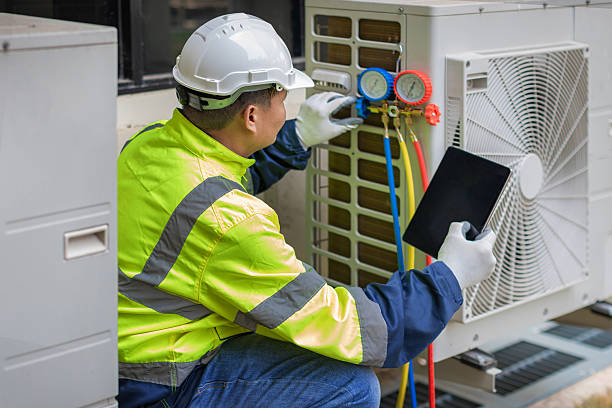 Professional Air Conditioning Repair technician working in Woodville, OH
